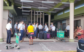 LDS church missionaries are joined by well-wishers at Amata Kabua International Airport in Majuro