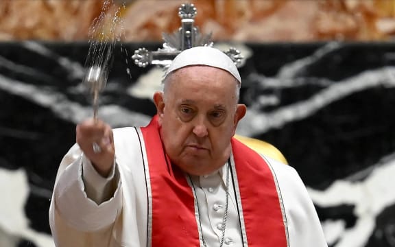 Pope Francis (C) presides over the funeral of Italian Cardinal Sergio Sebastiani at the altar of the Chair in St. Peter's Basilica in the Vatican, on January 17, 2024. (Photo by Filippo MONTEFORTE / AFP)