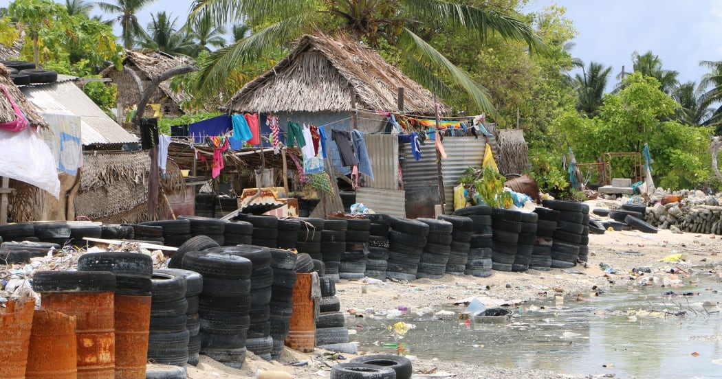Villagers have resorted to using tires and barrels for protection from the sea