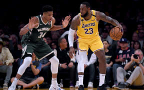 Milwaukee Bucks forward Giannis Antetokounmpo (L) marks Los Angeles Lakers guard/forward LeBron James in the NBA.