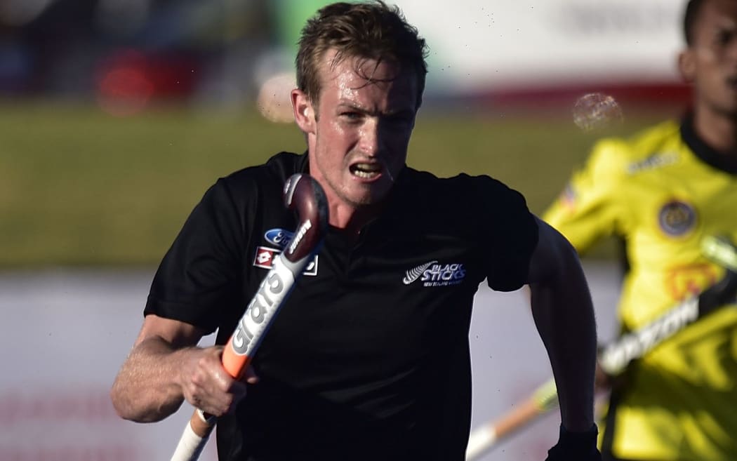 Hugo Inglis of the Black Sticks chases after the ball.