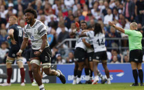 Fiji players celebrate after the whistle at the World Cup warm-up match between England and Fiji at Twickenham Stadium on 26 August.