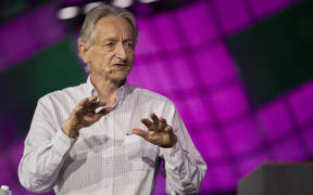 British-Canadian cognitive psychologist and computer scientist Geoffrey Hinton, known as the 'godfather of AI' speaks with Nick Thompson of The Atlantic (off frame) during the Collision Tech Conference at the Enercare Centre in Toronto, Ontario, Canada, on June 28, 2023. (Photo by Geoff Robins / AFP)