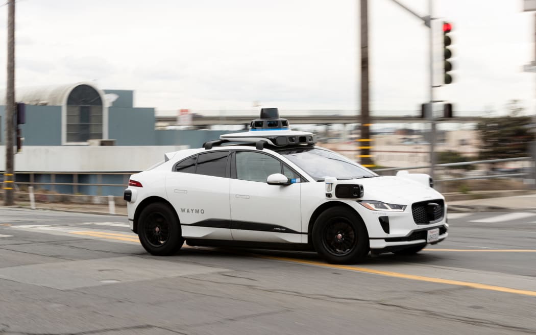 A Waymo autonomous vehicle on Cesar Chavez Street in San Francisco, on November 17, 2023. (Photo by Jason Henry / AFP)