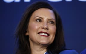 (FILES) In this file photo taken on January 27, 2020, Michigan Governor Gretchen Whitmer stands on stage at an event