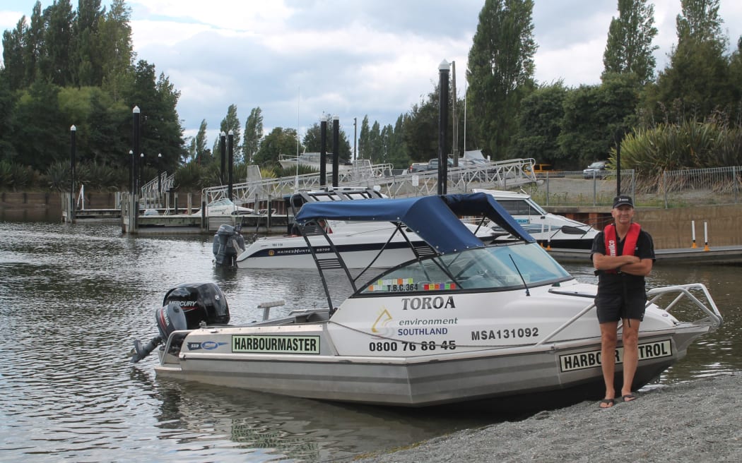 Cleaver pictured next to the Toroa. His team is in charge of not only recreational boating, but also commercial boating and shipping.