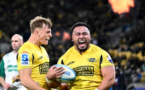 Ruben Love and Asafo Aumua of the Hurricanes celebrate, 2024