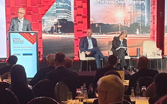 John Key and Helen Clark on stage at the China Business Summit.