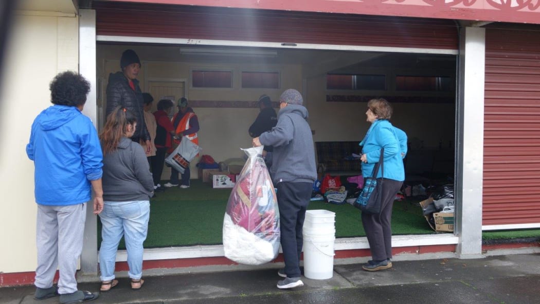 People drop off donations at Te Puea Marae.