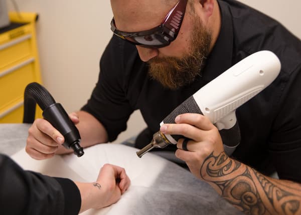 Hayden Ayrton, a tattoo removal specialist from Feather Touch Cosmetic Tattoo in Wellington.