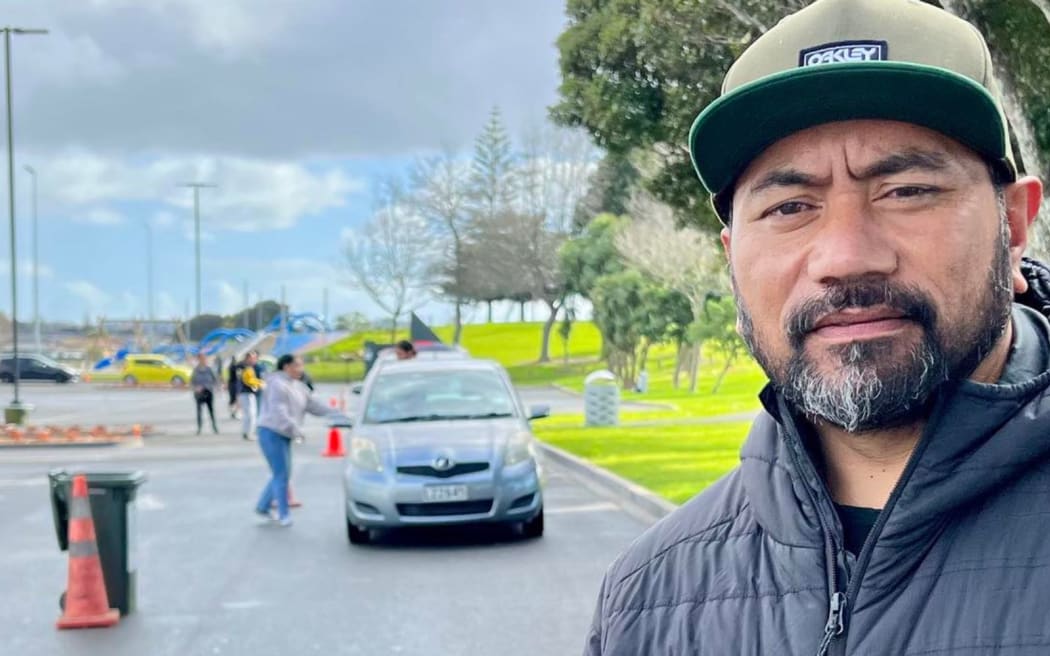 Lionel Hotene at Māngere Centre Park with Kai Ika underway in the background.