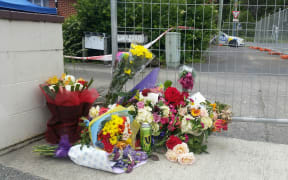 Flowers at the scene of the flat on Ward St in Upper Hutt where Lois Tolley, 30, was found dead early on Saturday.