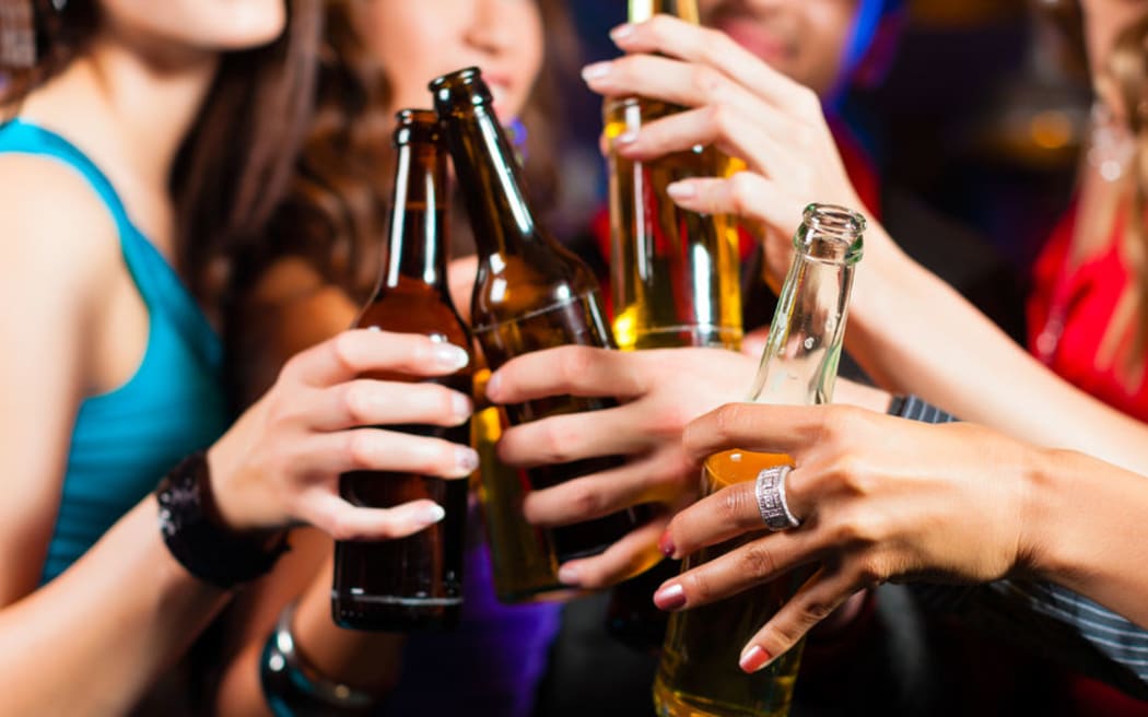 Women in a bar with beers