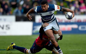 Auckland's Charles Piutau is tackled by a Tasman player, 2015.