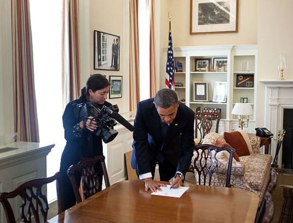 Hope Hall in action as a videographer for Barack Obama