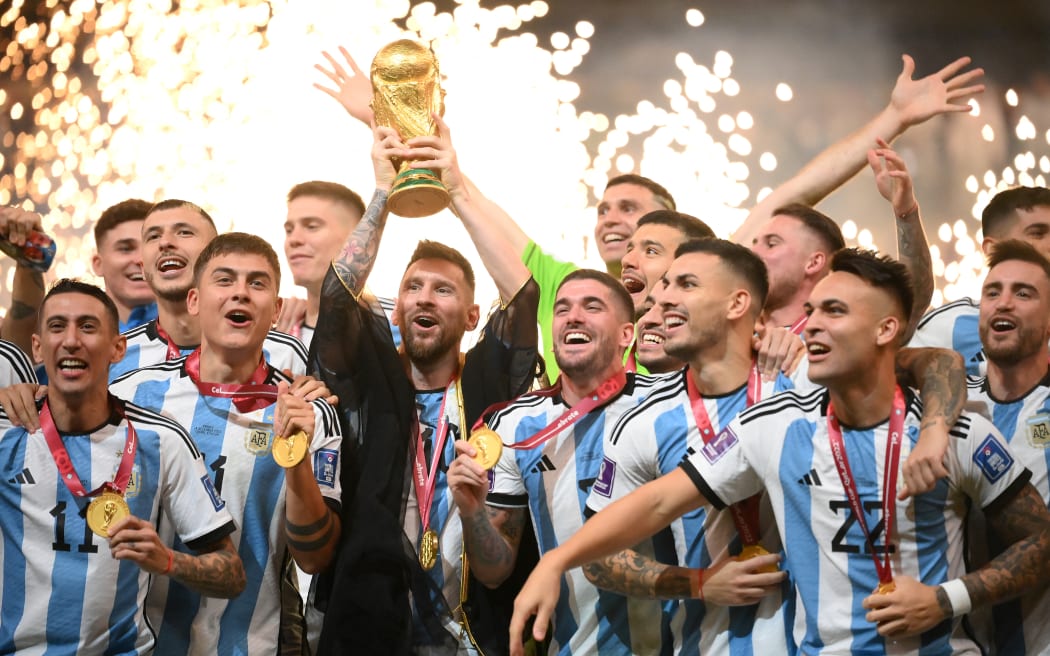 Argentina captain Lionel Messi lifts the World Cup trophy after the between Argentina and France at Lusail Stadium at the Lusail Stadium, north of Doha on December 18, 2022.