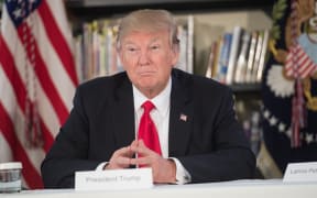 US President Donald Trump meets with parents and teachers at Saint Andrew Catholic School in Orlando, Florida.
