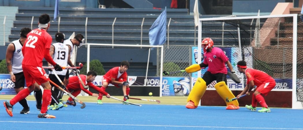 China attack the Fiji goal.