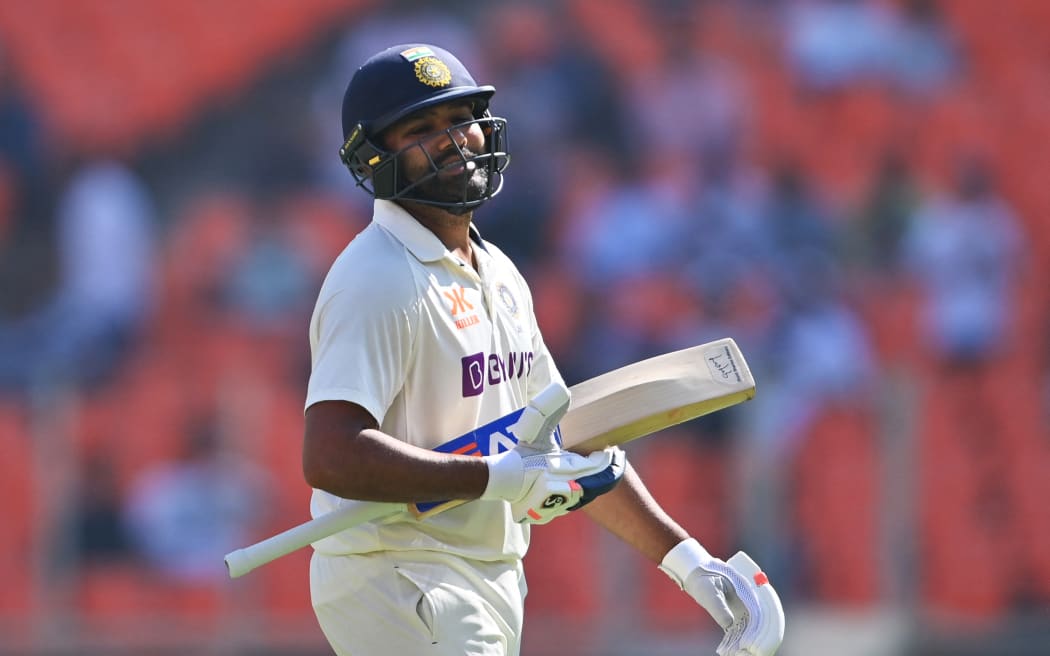 India's captain Rohit Sharma walks back to the pavilion after his dismissal during the third day of the fourth and final Test cricket match between India and Australia at the Narendra Modi Stadium in Ahmedabad on March 11, 2023. (Photo by Punit PARANJPE / AFP) / ----IMAGE RESTRICTED TO EDITORIAL USE - STRICTLY NO COMMERCIAL USE-----