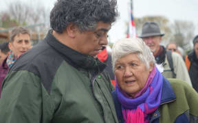 Otaraua hapū chair Rawiri Doorbar comforts a kuia during the hikoi.
