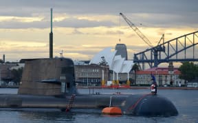 In this photo taken on October 12, 2016, a Royal Australian Navy diesel and electric-powered Collins Class submarine sits in Sydney Harbour.