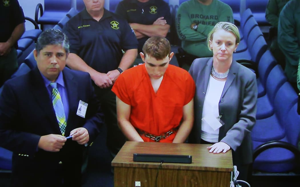 High school shooting suspect Nikolas Cruz (C) during an earlier court appearance.