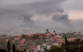 A view of the Motor Pool district of Noumea on May 15, 2024, amid protests linked to a debate on a constitutional bill aimed at enlarging the electorate for upcoming elections of the overseas French territory of New Caledonia. One person was killed, hundreds more were injured, shops were looted and public buildings torched during a second night of rioting in New Caledonia, authorities said Wednesday, as anger over constitutional reforms from Paris boiled over. (Photo by Delphine Mayeur / AFP)