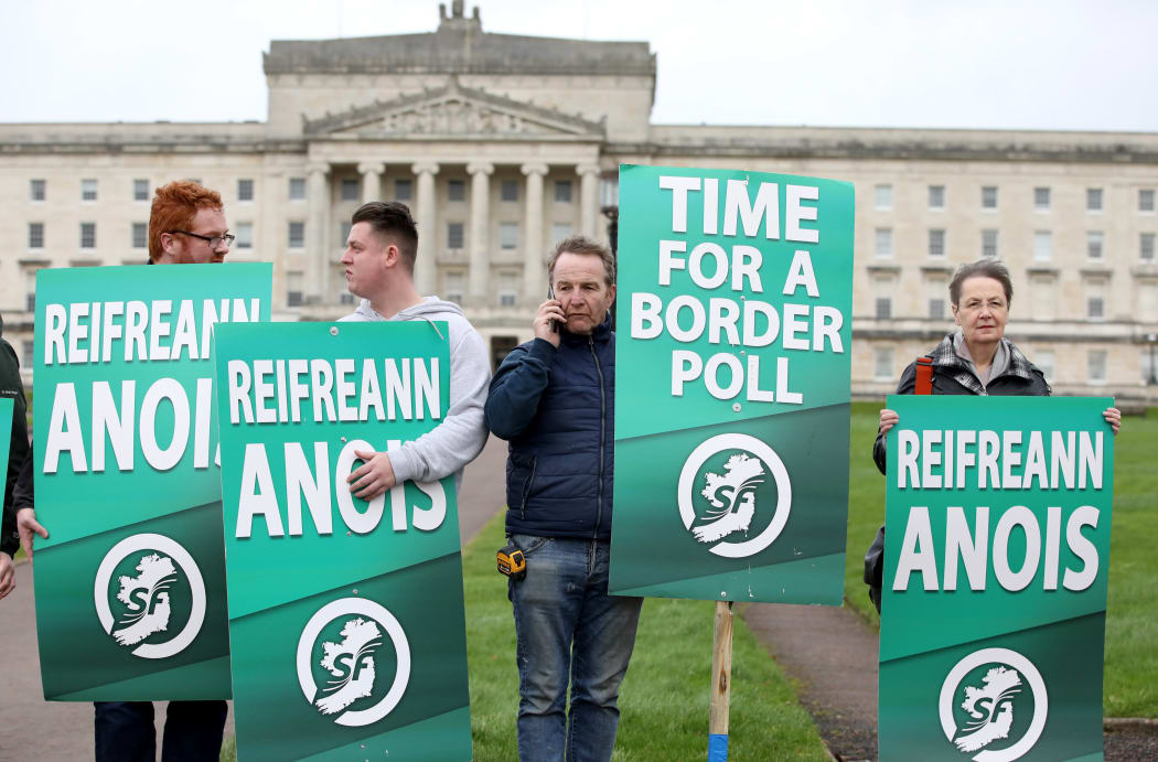Sinn Fein activists protest at the Parliament Buildings on the Stormont Estate in Belfast against Brexit and call for a border poll on Irish Unity.