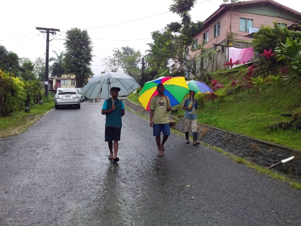 Voters donned gumboots and sheltered under umbrellas to go to cast their vote with heavy rain warning in force.