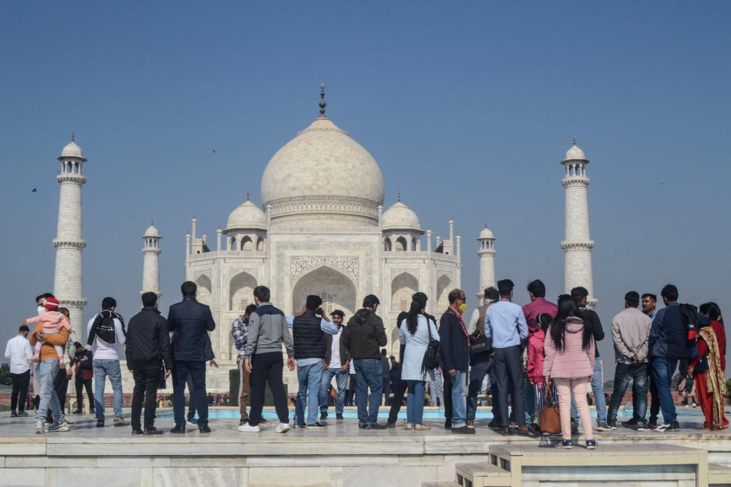 Tourists visit the Taj Mahal in Agra on December 19, 2020, as India surged past 10 million Covid-19 coronavirus cases. (Photo by Pawan SHARMA / AFP)