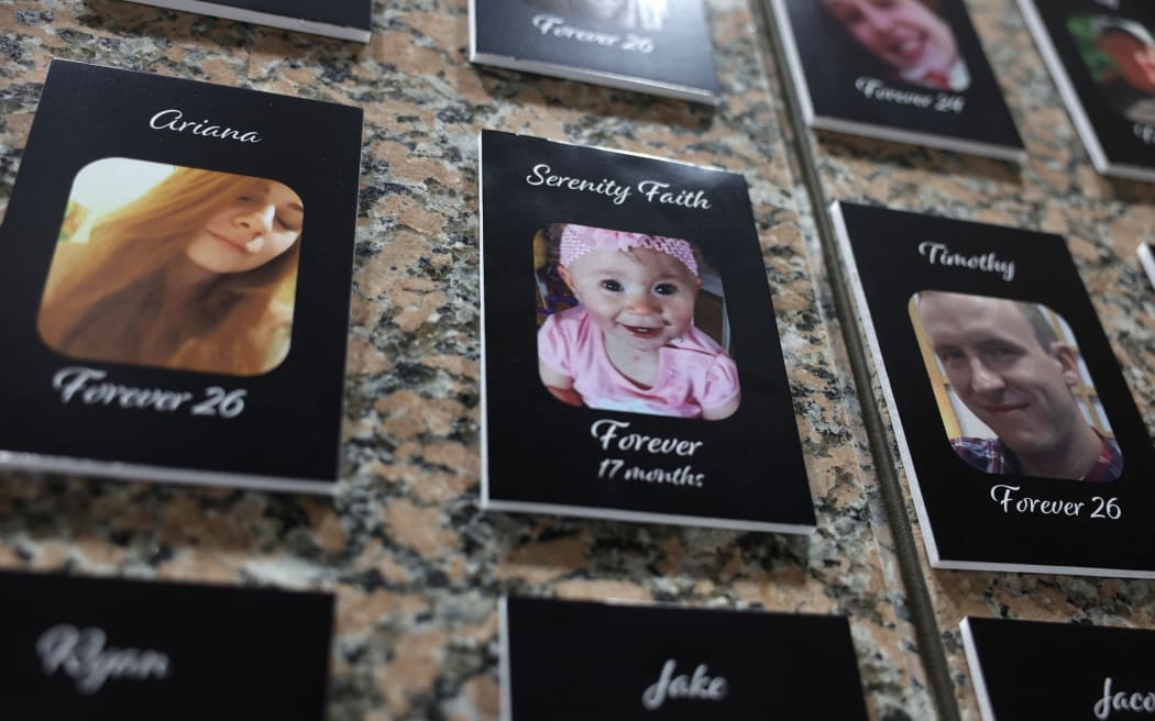 Photos of fentanyl victims  on display at The Faces of Fentanyl Memorial at the US Drug Enforcement Administration headquarters in 2022, in Arlington, Virginia.