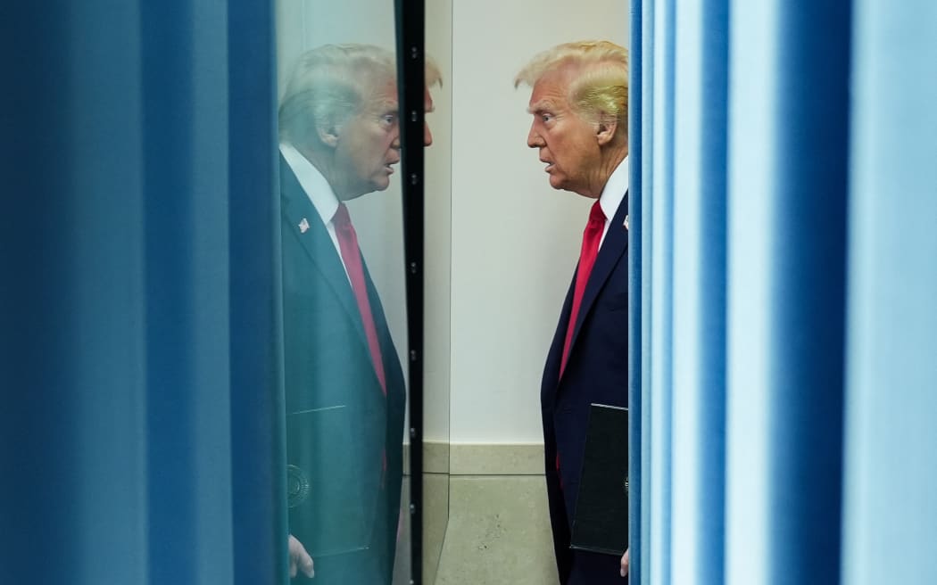 US President Donald Trump arrives to speak about the mid-air crash between American Airlines flight 5342 and a military helicopter in Washington - on 30 January, 2025 in Washington, DC.