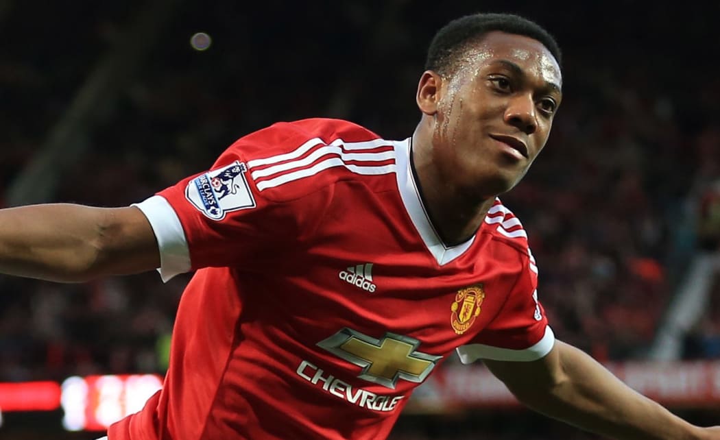 Manchester United's Anthony Martial celebrates after scoring their 3rd goal.