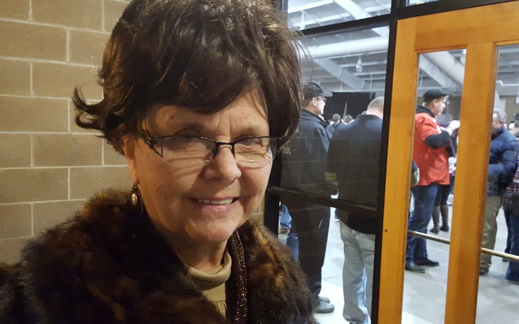 Republican voter stands outside hall doors