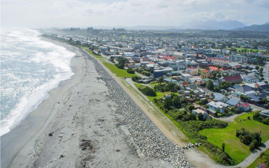 An aerial view of the Hokitika town centre and existing rock wall in the foreground. The existing rock protection is to be extended nearly 1km north.