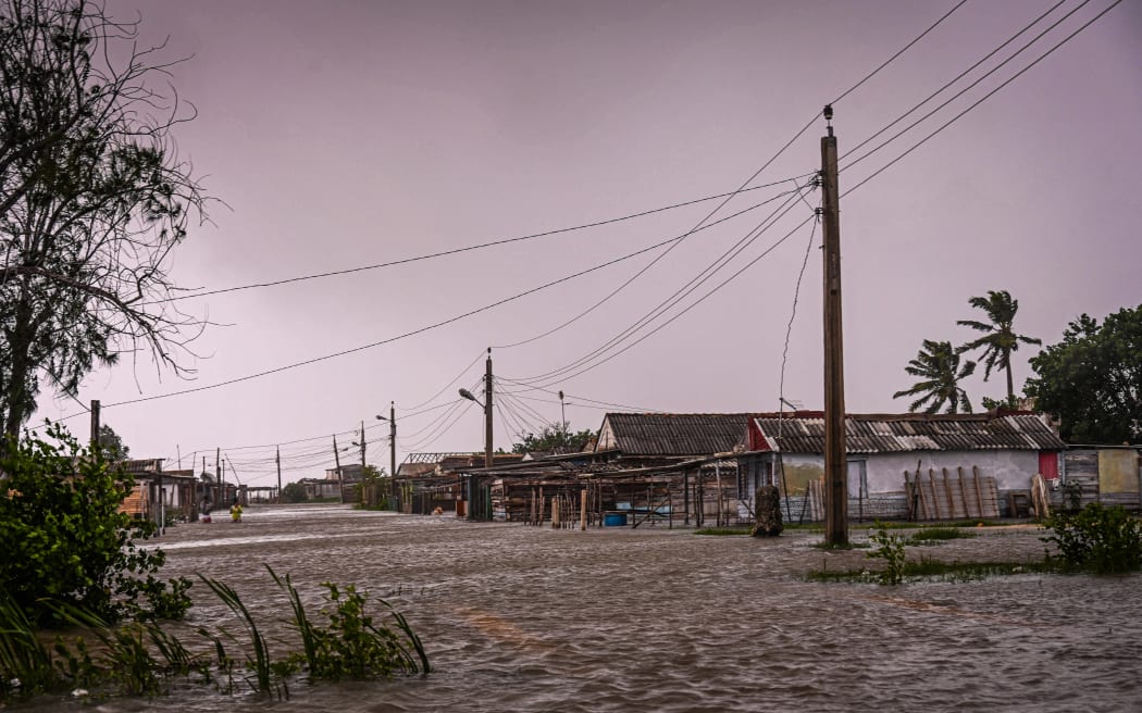 View of flooded houses in the coastal town of Guanimar, in Artemisa province, southwest of Havana, after the passage of Hurricane Helene on September 25, 2024. Tropical Storm Helene became a hurricane mid-morning in the Gulf of Mexico. 