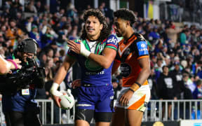 Dallin Watene-Zelezniak of the Warriors celebrates his try.