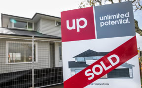 Sold sign outside a new house being built in East Auckland