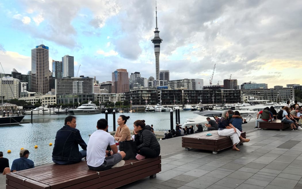 Crowds begin to gather to watch fireworks at Auckland's Sky Tower.