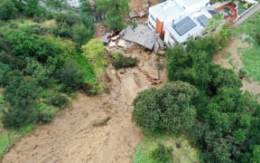 LOS ANGELES, CALIFORNIA - FEBRUARY 05: An aerial view of a home destroyed by a mudslide as a powerful long-duration atmospheric river storm, the second in less than a week, continues to impact Southern California on February 5, 2024 in Los Angeles, California. No one was in the home at the time. The storm is delivering widespread flooding, landslides and power outages while dropping heavy rain and snow across the region.   Mario Tama/Getty Images/AFP (Photo by MARIO TAMA / GETTY IMAGES NORTH AMERICA / Getty Images via AFP)