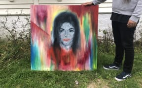 Roy Irwin with his unique painting of Michael Jackson.