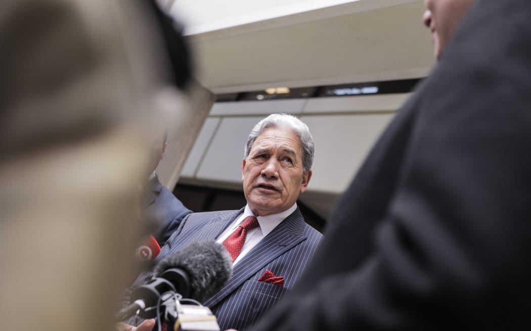 Winston Peters speaks to media after emerging from the Treasury offices, as negotiations for forming a government with National and ACT continue.