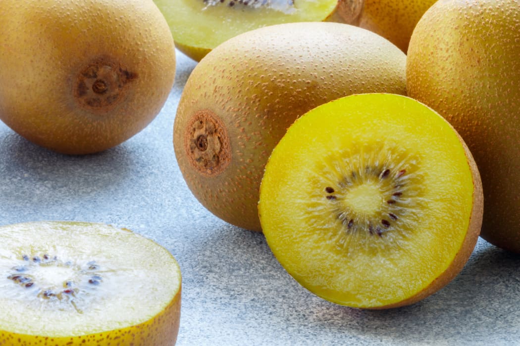 A stock photo of gold kiwifruit.