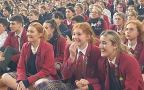 Kavanagh College students cheer on their head girl, Olympic swimmer Erika Fairweather.
