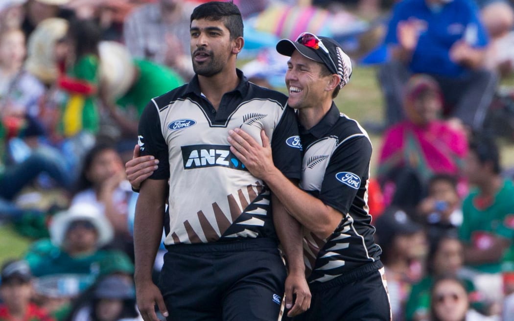 Ish Sodhi is congratulated by Trent Boult.