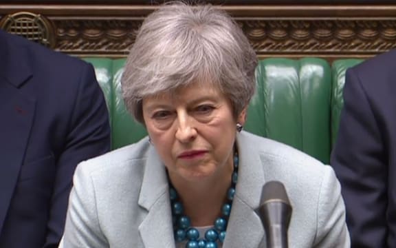 Britain's Prime Minister Theresa May listen as opposition leader Jeremy Corbyn speaks in the House of Commons in London on March 25, 2019 after May outlined the next steps that parliament will take in the Brexit process.