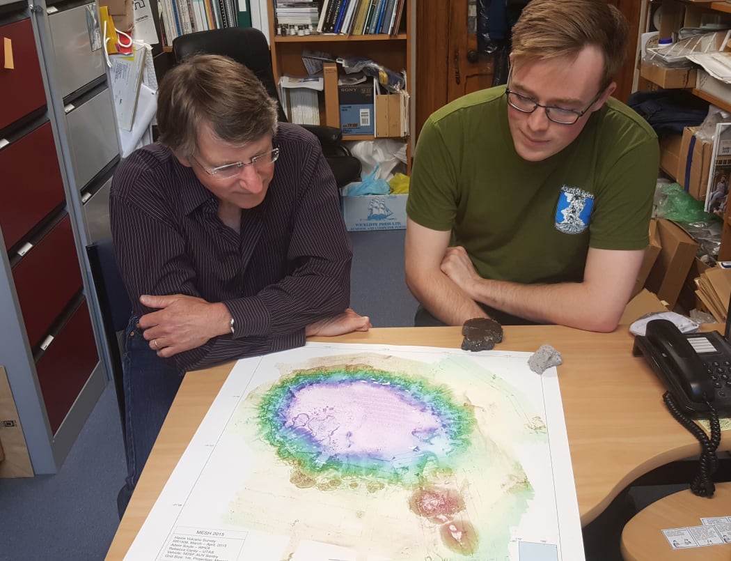 James White and Arran Murch with a detailed map of Havre volcano showing how it looks after a big eruption in 2012.