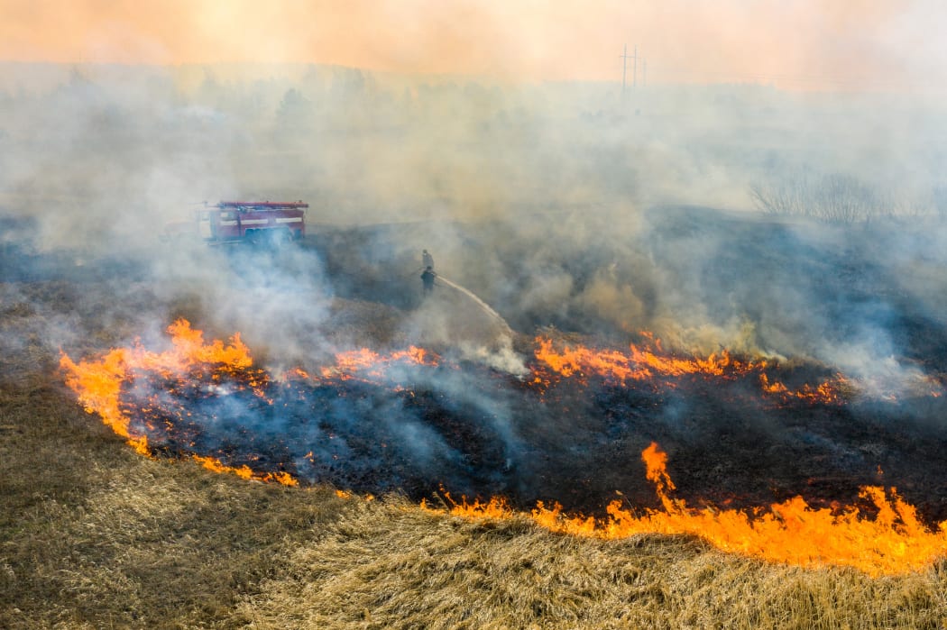 This picture taken on April 10, 2020, shows a field fire burning at a 30-kilometre Chernobyl exclusion zone, not far from the nuclear power plant.
