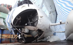 The damaged helicopter cockpit on board the fishing vessel Jih Yu 868 in Majuro a few days after the crash in Nauru waters that killed two.