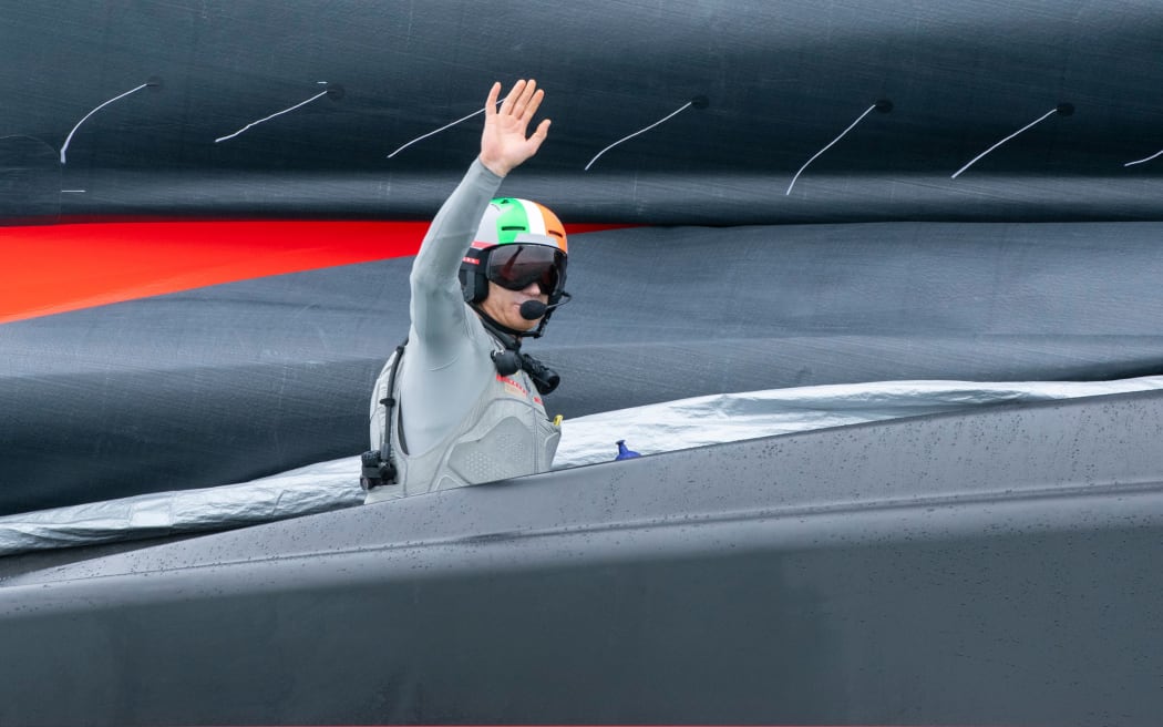 Luna Rossa Prada Pirelli Team helmsman Jimmy Spithill gives a wave after winning four races from four starts against INEOS Team UK in the Prada Cup Finals.